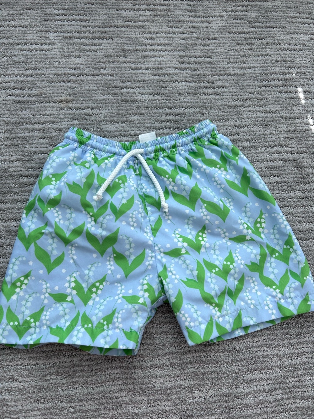 Cecil and Lou Boys Light Blue Swim Shorts with Green & White Lily Pattern